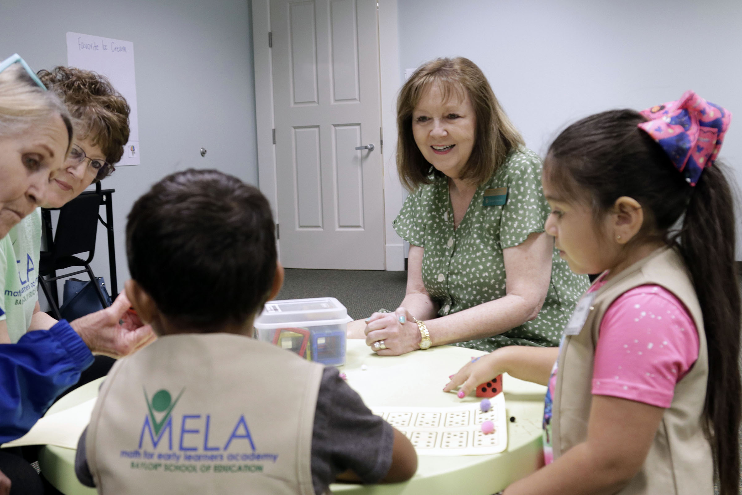 Student learning math with BNCTM president Dr. Trena WIlkerson at Baylor Math for Early Learners Academy