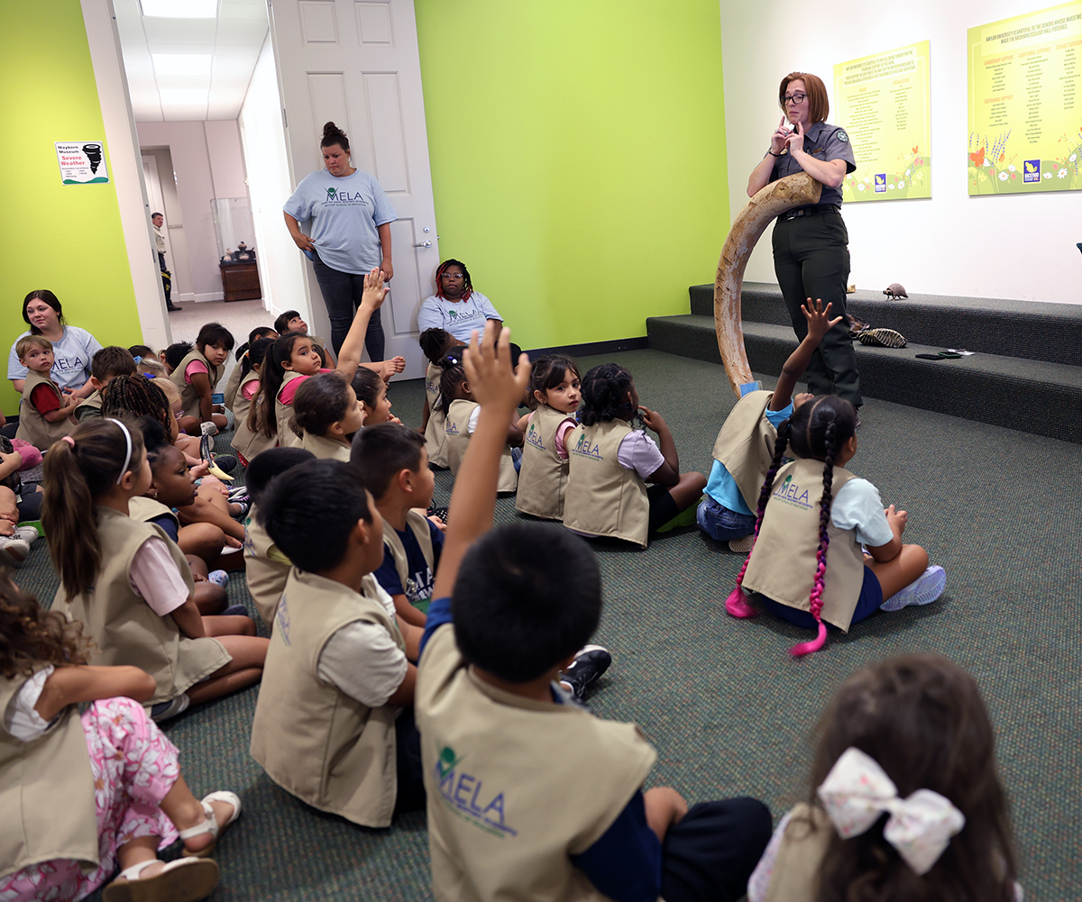 Mammoth Park Ranger showing tusk to MELA students