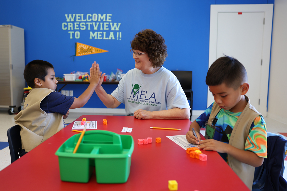 MELA director Dr. Sandi Cooper teaching MELA students