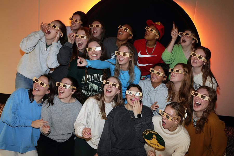 Students pictured in eclipse safety glasses